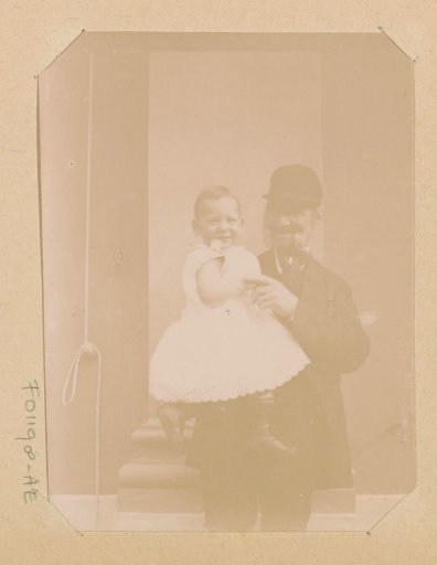 Portrait of an unknown old man with a toddler on his arm