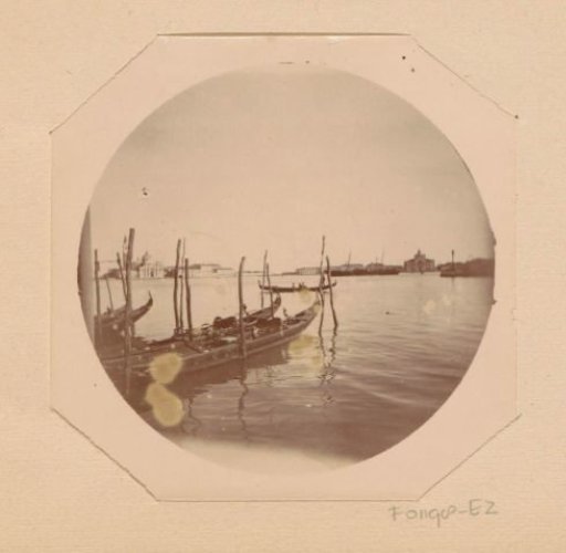 View of gondolas in the lagoon of Venice, in the distance to the right the Santa Maria della Presentazione and to the left the church of San Giorgio Maggiore