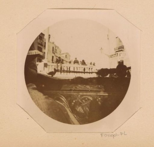 View of a bridge in Venice from a gondola
