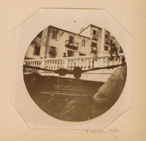 View of a bridge in Venice from a gondola