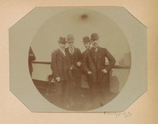 Four students from the Public Trade School posing on board a ship during an excursion to the Baltic Sea