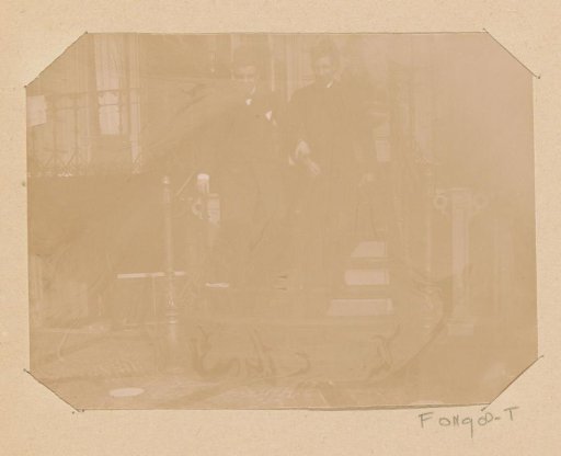 Two unknown young men on an outdoor staircase