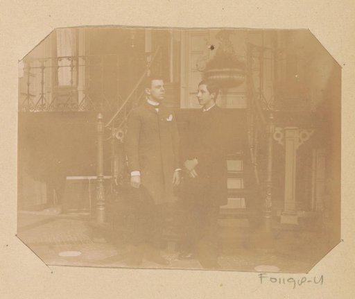 Two unknown young men on an outdoor staircase