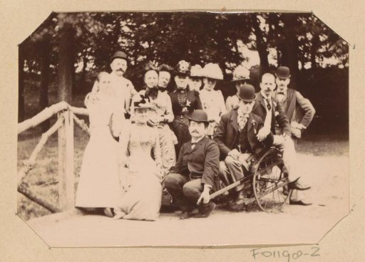 Group portrait of the Piek family around a wooden cart
