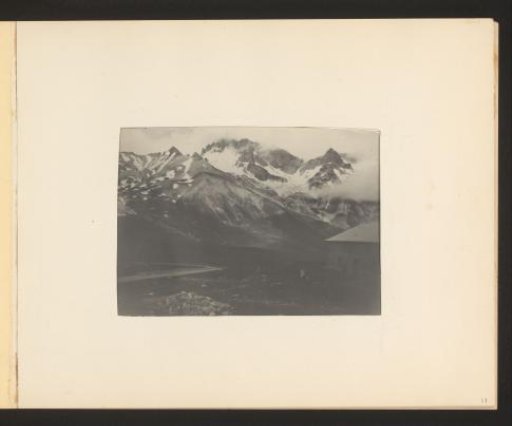 View of a mountain valley with a building on the right