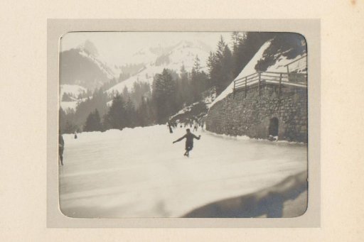 Skaters on a Frozen Mountain Lake