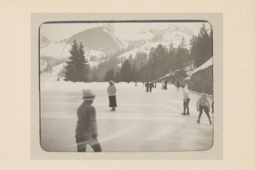 Skaters on a Frozen Mountain Lake
