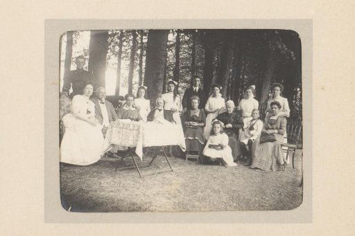 Group Portrait of a Company Around a Table in the Woods at Ellecom