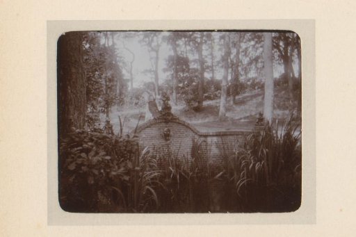 Woman standing by a water feature in a garden