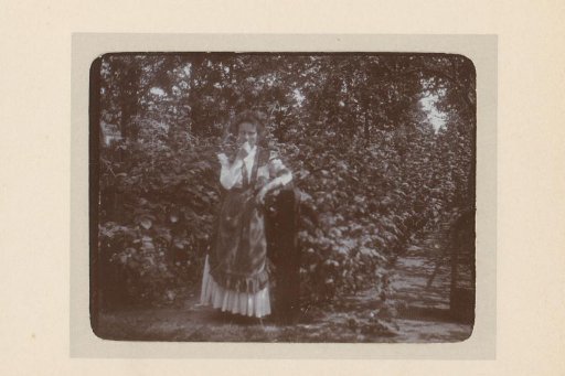 Portrait of a woman in an orchard