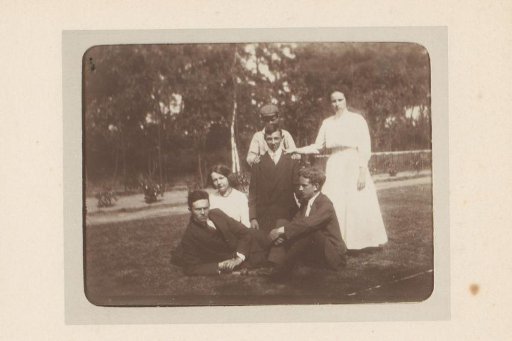 Group portrait of six young people in a meadow