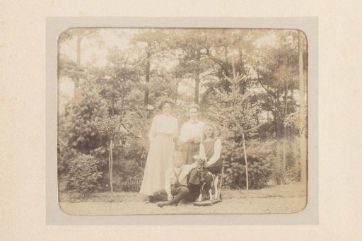 Group Portrait of Two Women, a Boy and a Girl in a Garden