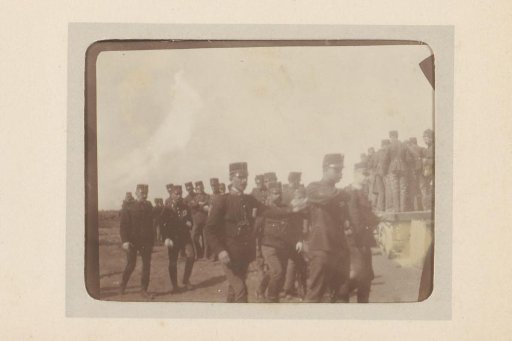 Group of soldiers walking across a field