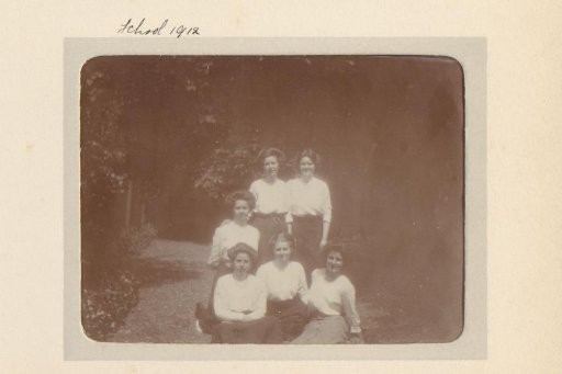 Group portrait of six young women in a garden