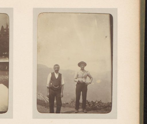 Portrait of two men at a viewpoint in the mountains