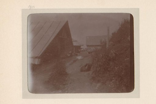 View of a farm with cattle in the mountains