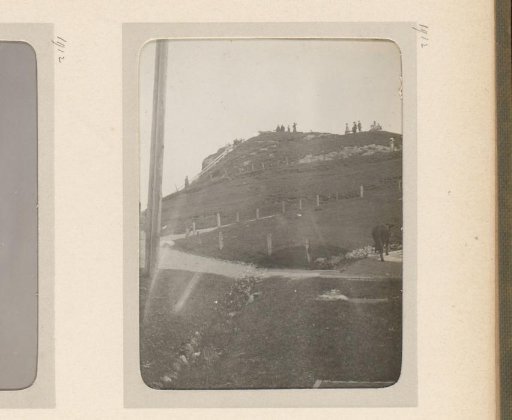 View of a path to a viewpoint, several people standing on the top