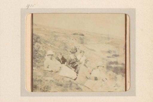 Group sitting on the ground in the dunes