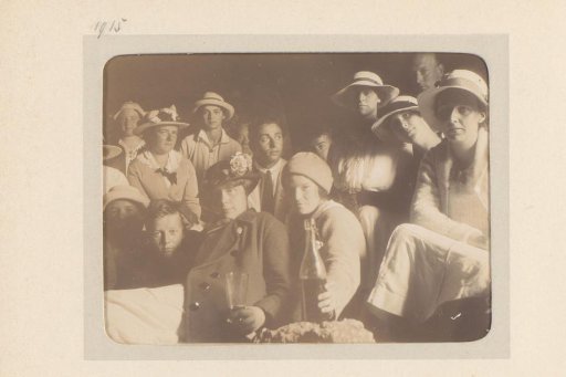 Group Portrait of a Company, Some Holding a Glass or Bottle