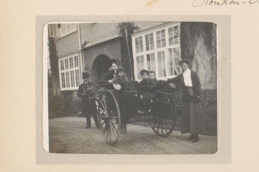 Two Women and Three Children by a Carriage in London