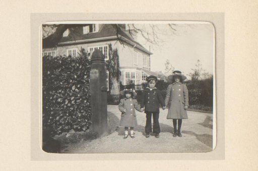 Portrait of Three Children on a Driveway