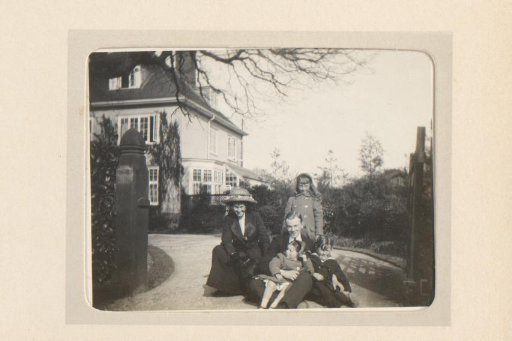 Portrait of a Man and Woman and Three Children on a Driveway