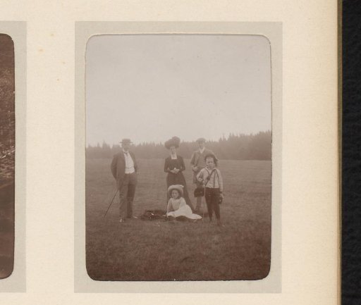 Portrait of Two Men, a Woman and Two Children in a Field