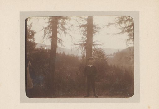 Portrait of a boy in a sailor's suit in a forest near Territet