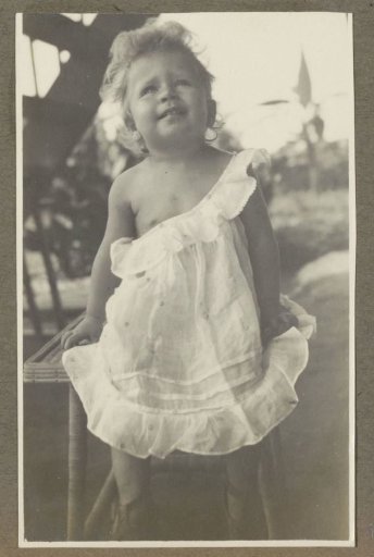 Portrait of a girl from the Janschen family in a light dress, in Medan
