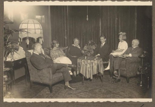 Group in a living room, possibly in the Netherlands