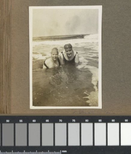 Two women in the sea, presumably near Wijk aan Zee