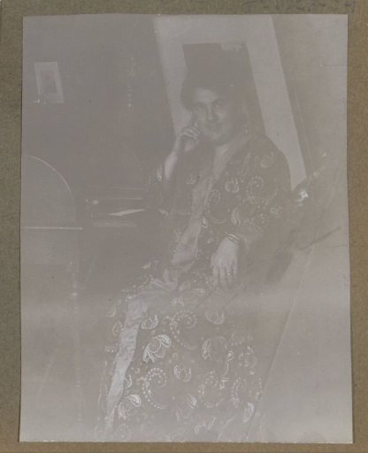 Portrait of an unknown woman, seated at a desk, possibly in Suriname