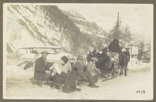 Group including members of the Ottenhof family behind a horse-drawn sleigh in St. Moritz