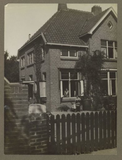 Two women at a dwelling