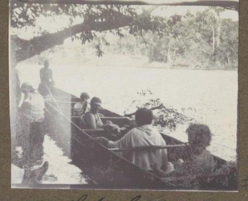 Group in a boat in Suriname, after a swim