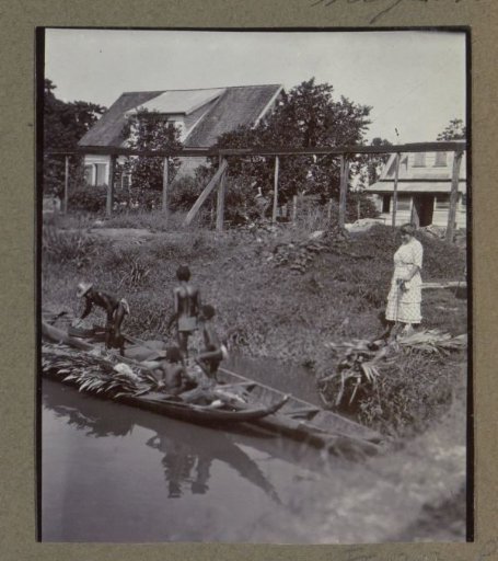 Woman looking at Maroons in a boat