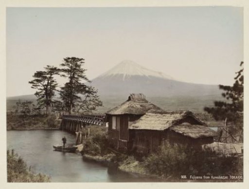 Mount Fujiyama seen from Kawaibashi, with a bridge and a building in the foreground