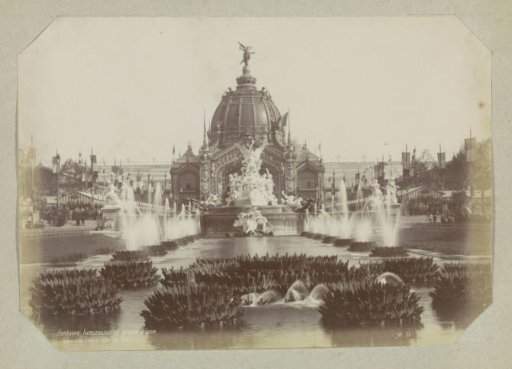 Illuminated fountain and the Palais des Industries on the grounds of the 1889 World's Fair in Paris