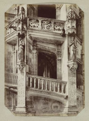 Part of a staircase in the Château of Blois with a bas-relief of a salamander at the bottom