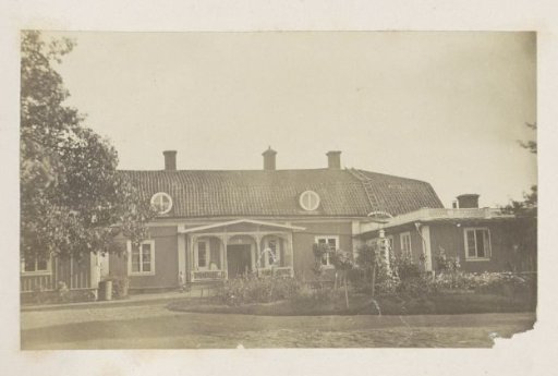 House with a Veranda and a Front Garden with a Sundial