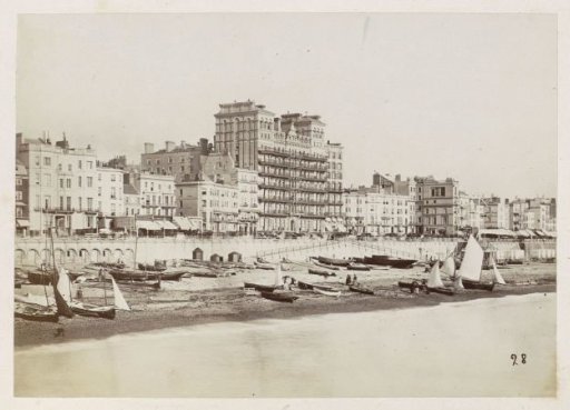 Buildings including the Grand Hotel and boats on Brighton beach