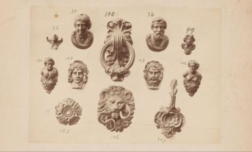 Metal ornaments in the form of lion and human heads