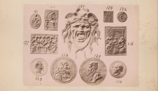 Metal plaquettes and coins and a Medusa head