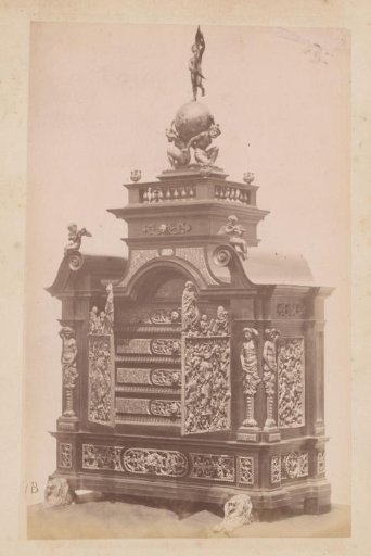 Ebony cabinet with gemstones, a sculpture and a door replica