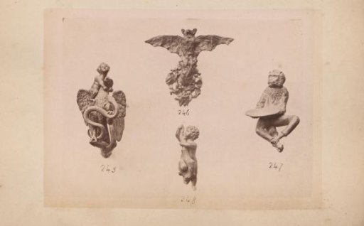 Metal sculptures of a bat, a monkey and nudes