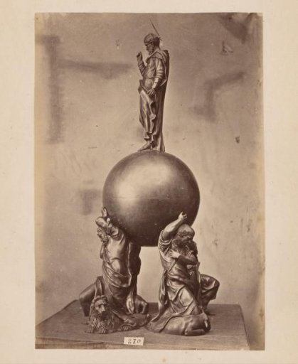 Metal vessel supported and crowned by figures