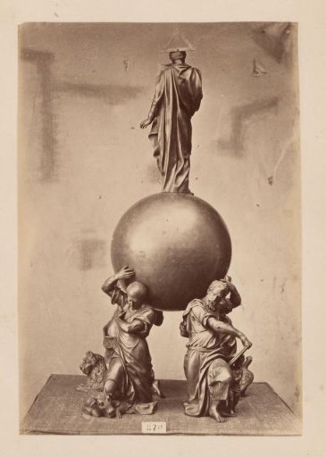 Metal vessel supported and crowned by figures