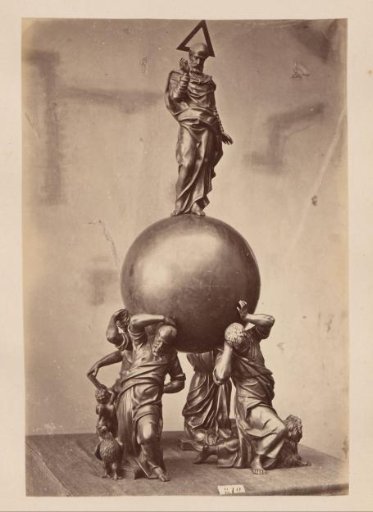 Metal vessel supported and crowned by figures
