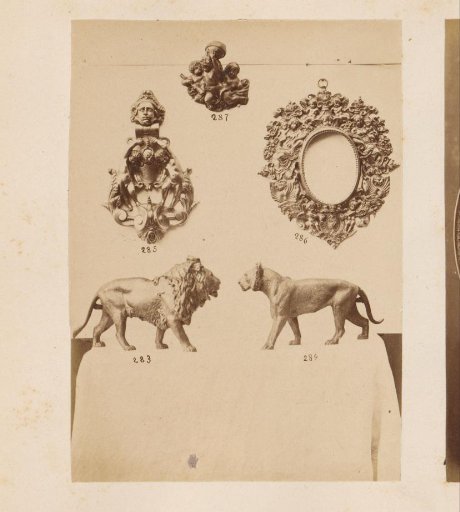Metal frame and sculptures of beasts and groups of persons