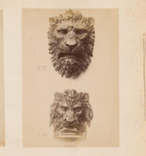 Two metal lion heads